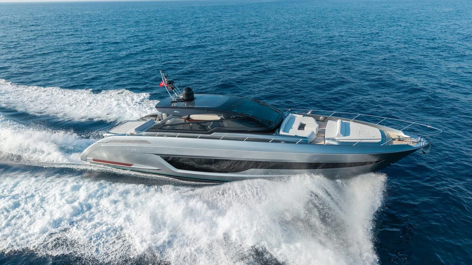 A sleek and modern yacht cruises swiftly through the open sea, showcasing its elegant design and powerful performance. aboard LUCE I Yacht for Sale