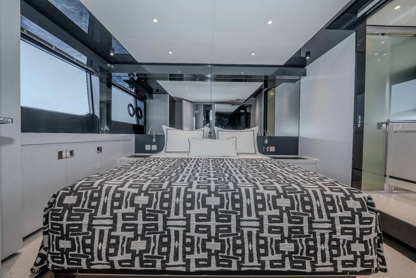 The master stateroom features a luxurious bed with modern decor and ample natural light. aboard LUCE I Yacht for Sale