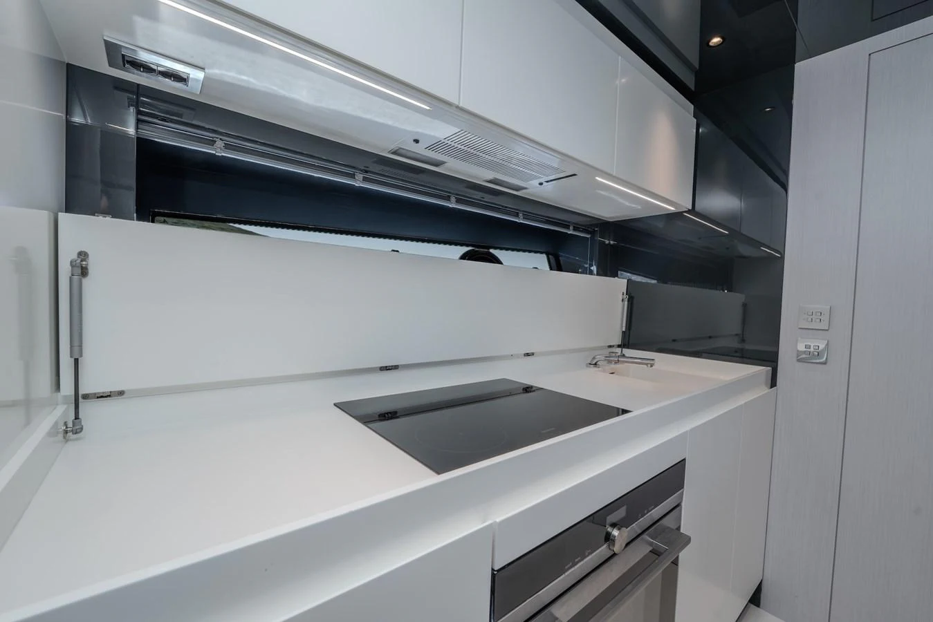 The sleek and modern galley features high-end appliances and ample counter space. aboard LUCE I Yacht for Sale