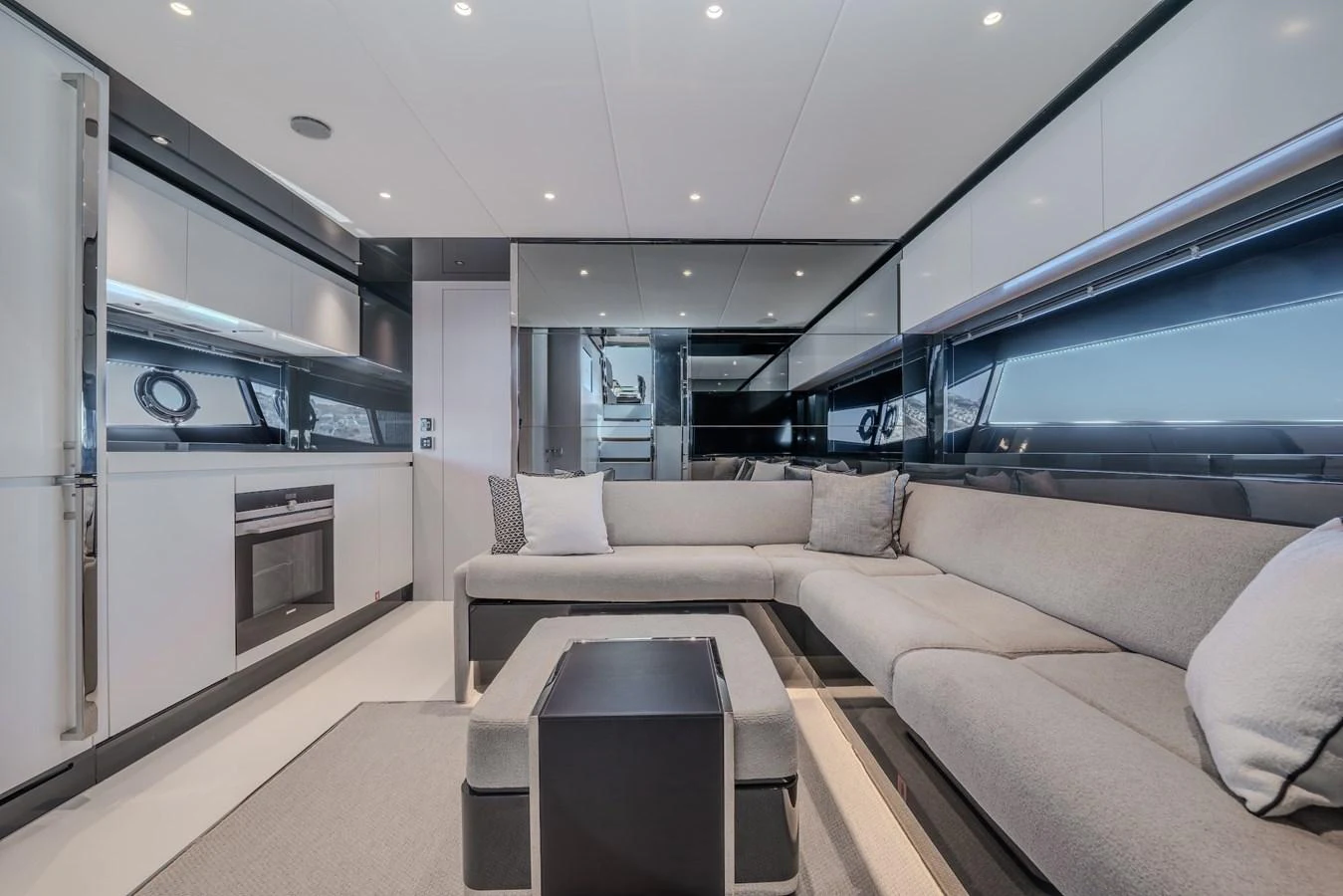 The salon offers a spacious and modern seating area with sleek design elements. aboard LUCE I Yacht for Sale