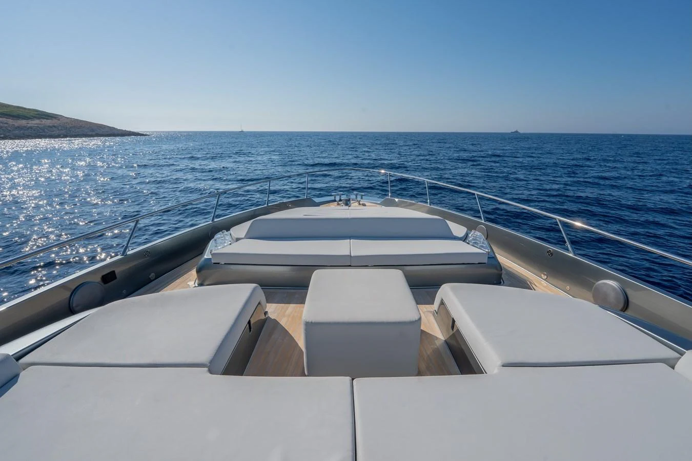 The foredeck of the yacht features spacious sun pads with a stunning ocean view. aboard LUCE I Yacht for Sale