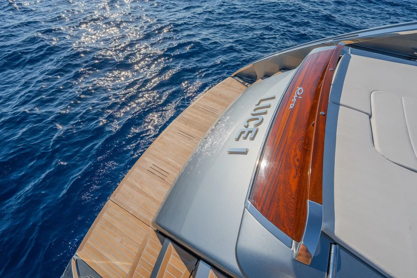 A close-up view of the yacht's stern showcasing the swim platform and elegant woodwork. aboard LUCE I Yacht for Sale
