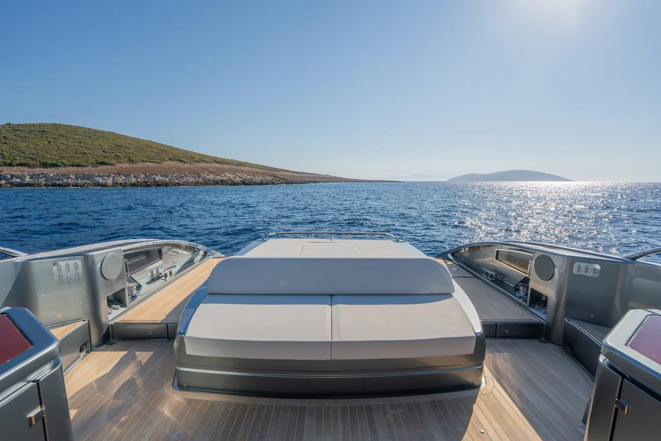 The yacht's aft deck offers a serene view of the open sea and distant islands, perfect for relaxation. aboard LUCE I Yacht for Sale