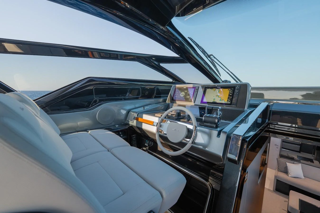 The helm station features modern navigation equipment and luxurious seating. aboard LUCE I Yacht for Sale