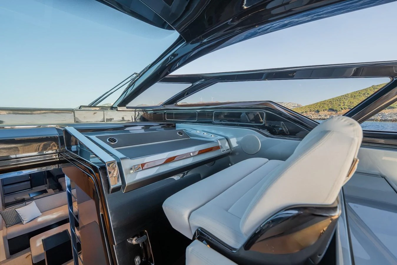 The helm station features sleek, modern design with expansive windows offering panoramic views. aboard LUCE I Yacht for Sale