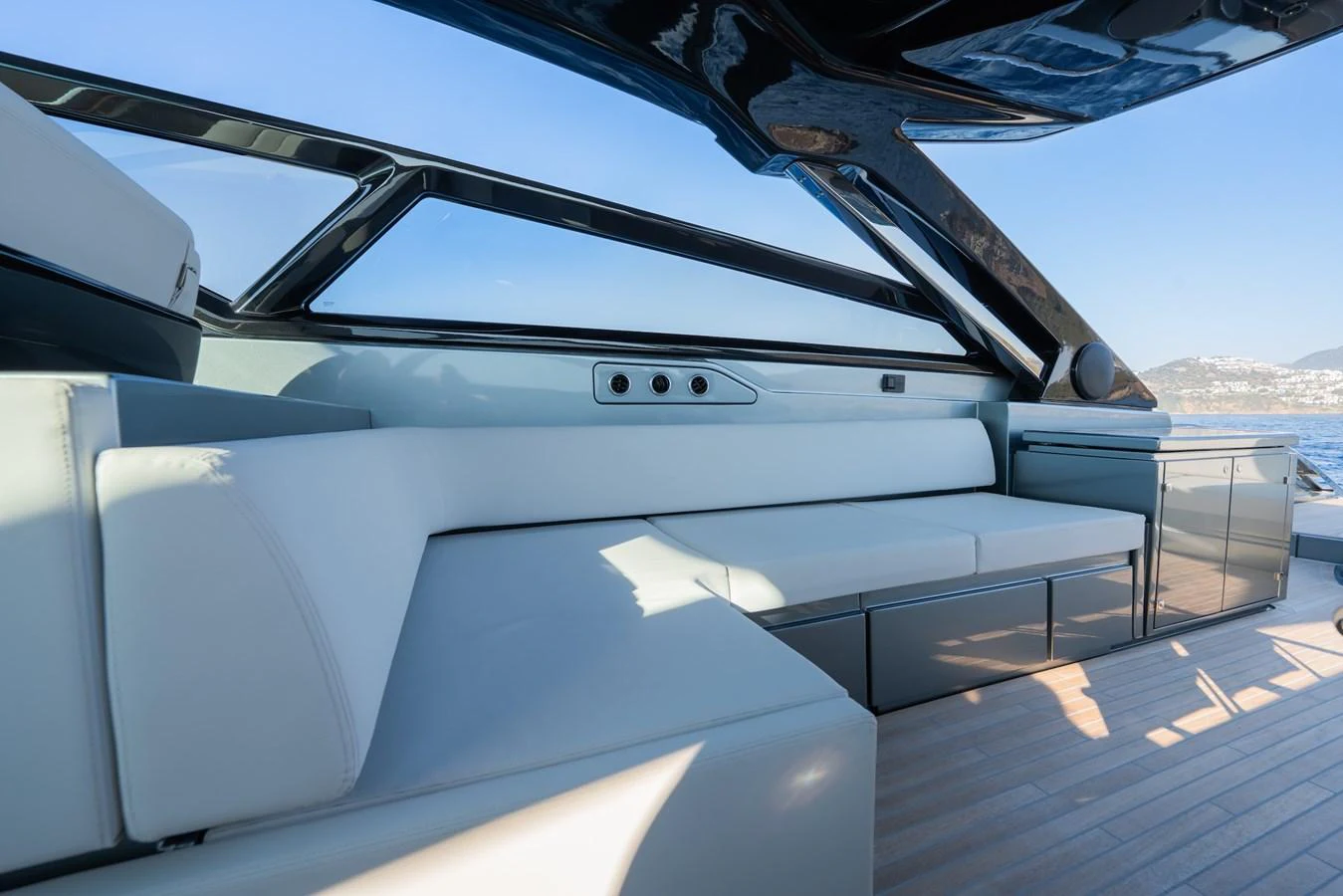 The cockpit features sleek, modern seating with ample natural light and panoramic views. aboard LUCE I Yacht for Sale