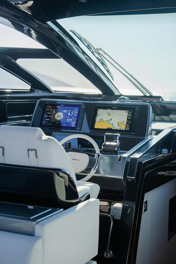 The helm station features modern navigation equipment and sleek design elements. aboard LUCE I Yacht for Sale