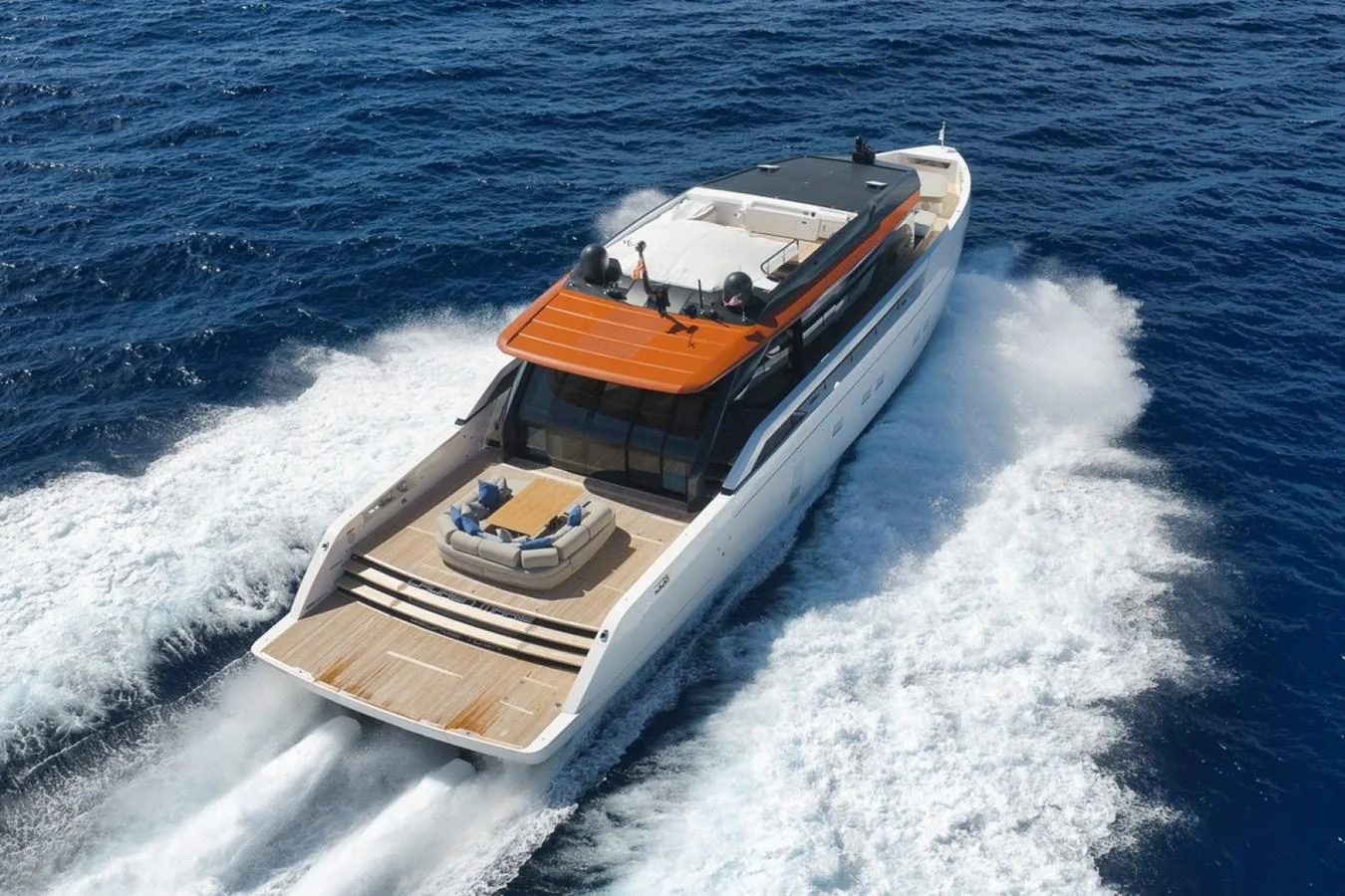 A sleek yacht cruises through the open sea, showcasing its modern design and spacious deck. aboard LAUREN MARIE Yacht for Sale