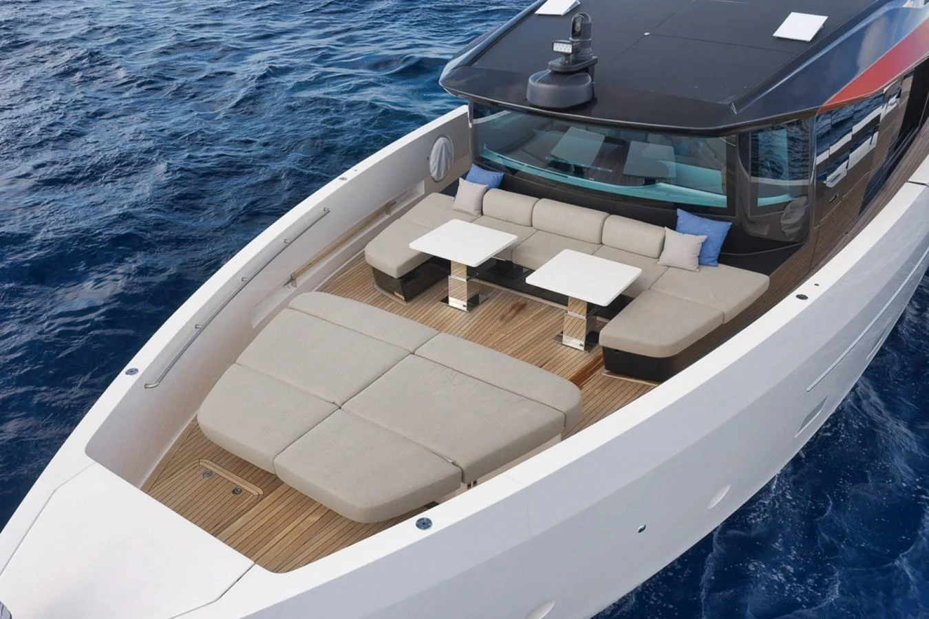The yacht's foredeck features spacious sunbeds and seating areas with tables, perfect for relaxation. aboard LAUREN MARIE Yacht for Sale