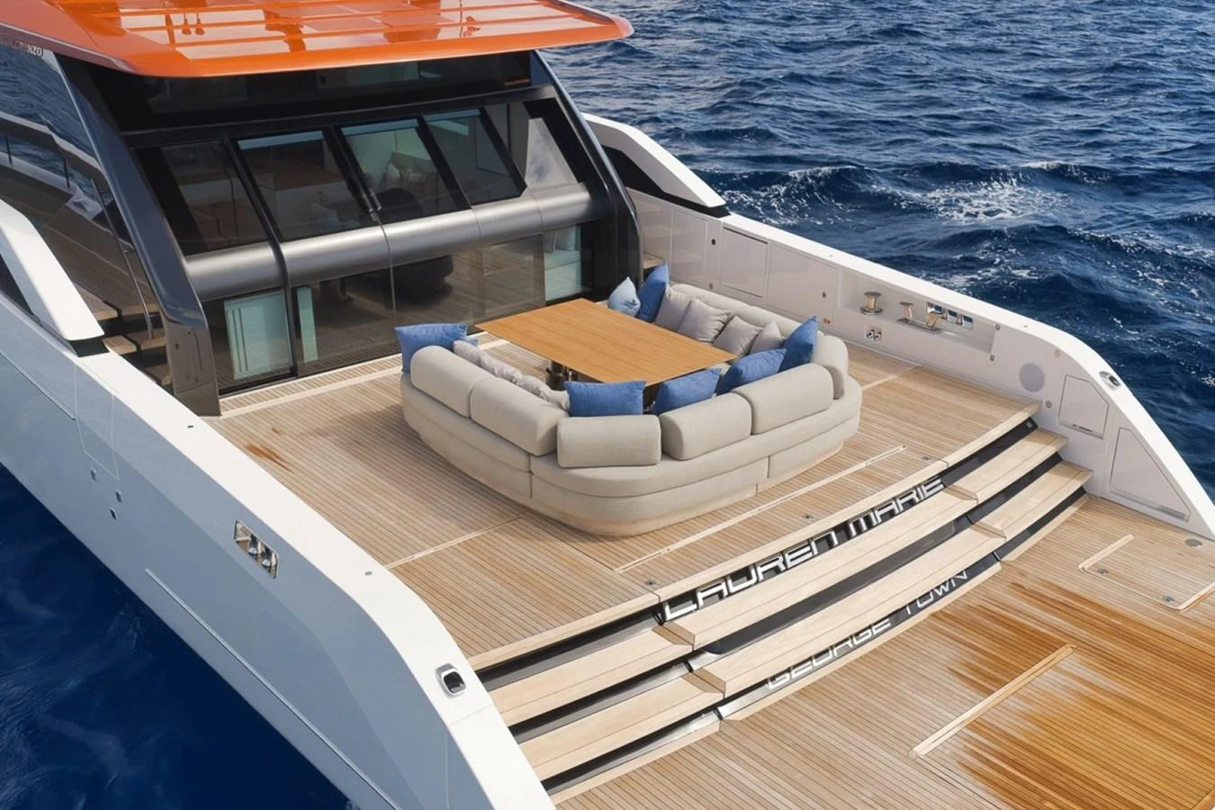 The aft deck features a spacious seating area with a central table, perfect for relaxing and enjoying the ocean views. aboard LAUREN MARIE Yacht for Sale