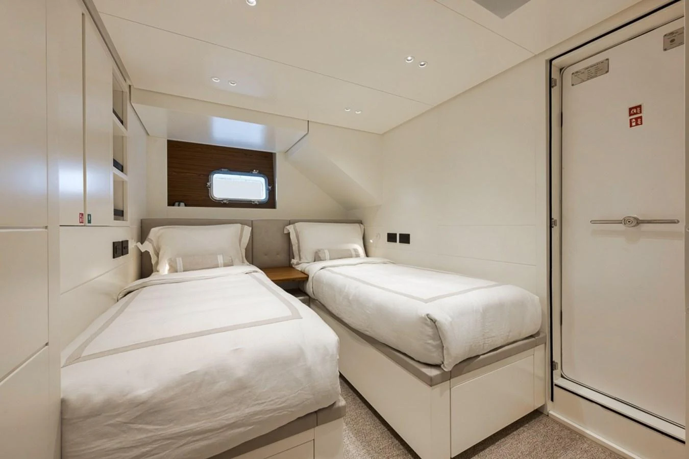 The twin cabin offers a cozy and comfortable sleeping arrangement with two single beds and modern amenities. aboard LAUREN MARIE Yacht for Sale
