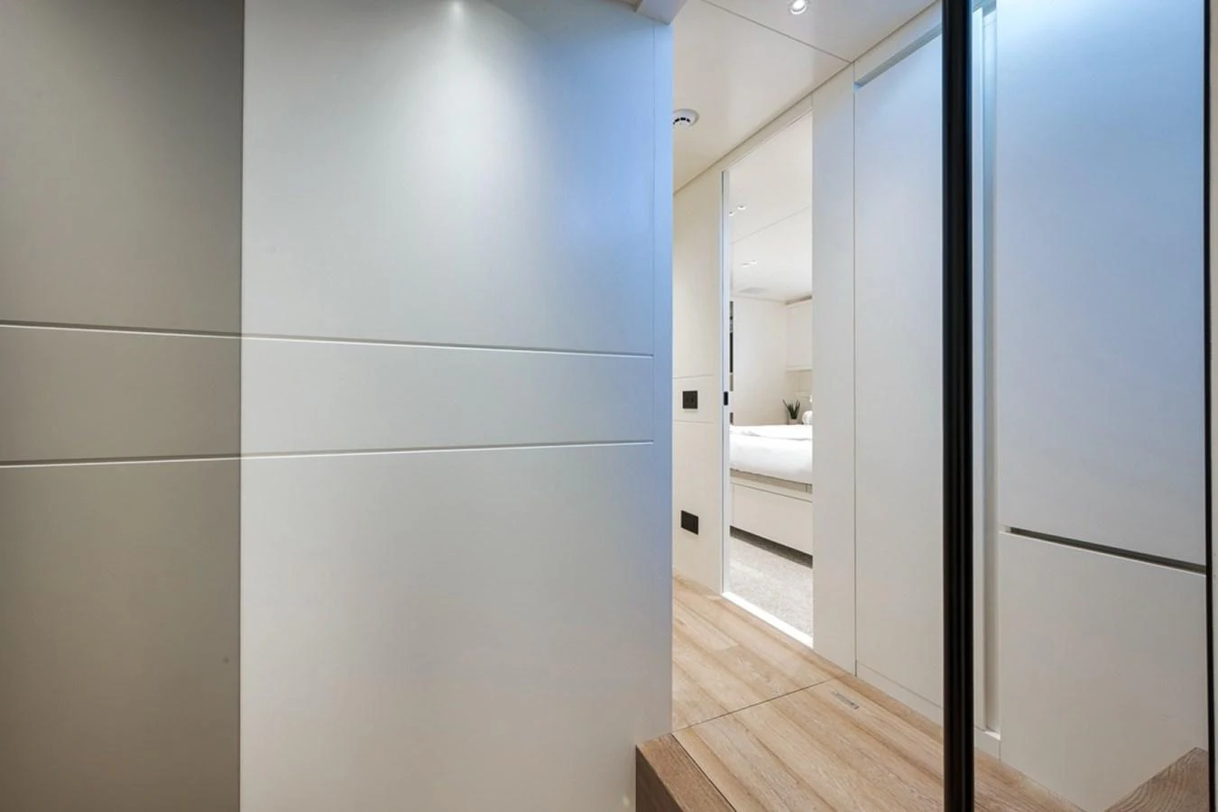 A modern and sleek hallway leading to a cozy stateroom. aboard LAUREN MARIE Yacht for Sale