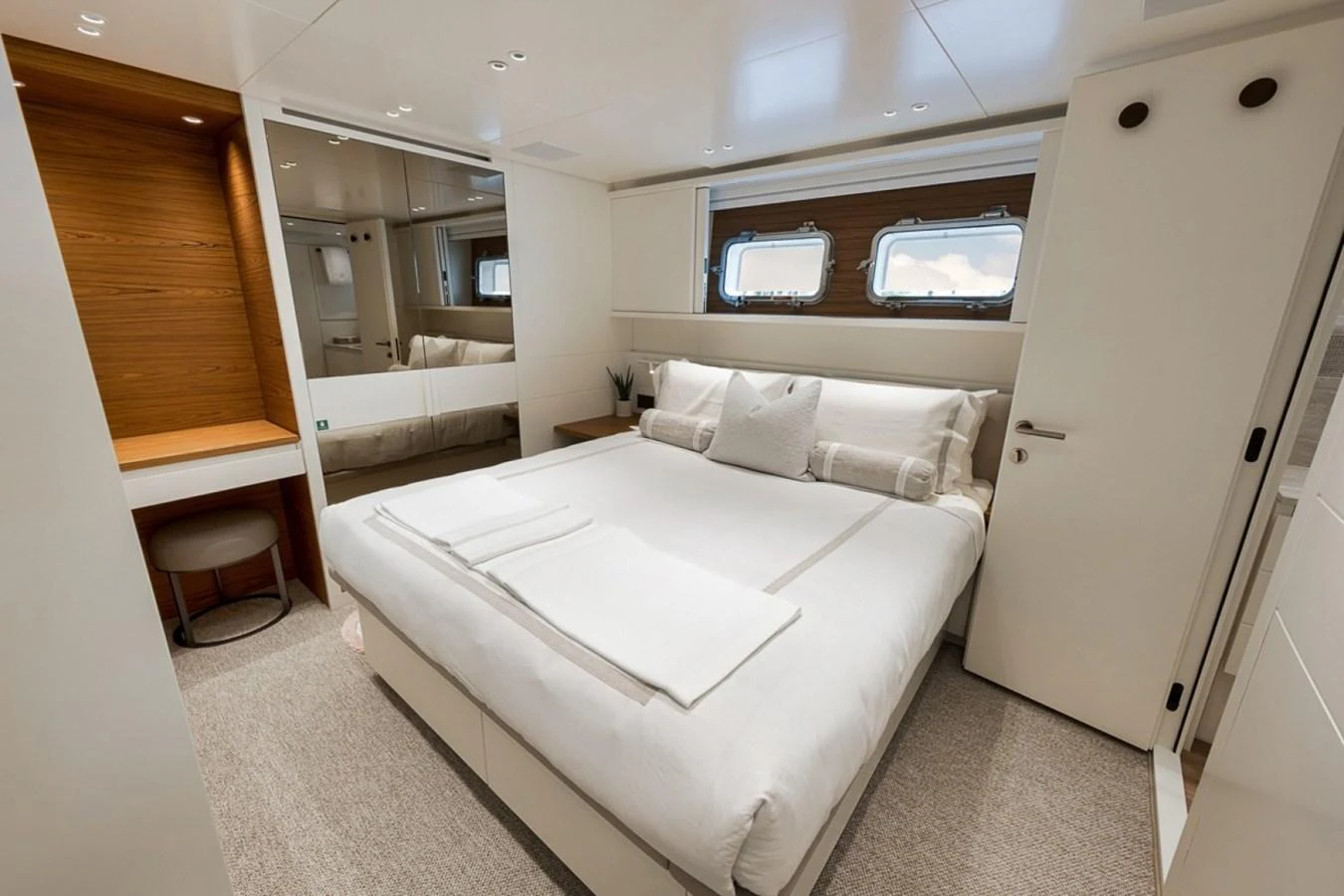A luxurious stateroom with a large bed and modern furnishings. aboard LAUREN MARIE Yacht for Sale