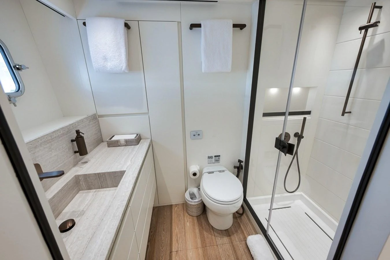 The yacht's bathroom features a modern design with a spacious shower and elegant fixtures. aboard LAUREN MARIE Yacht for Sale