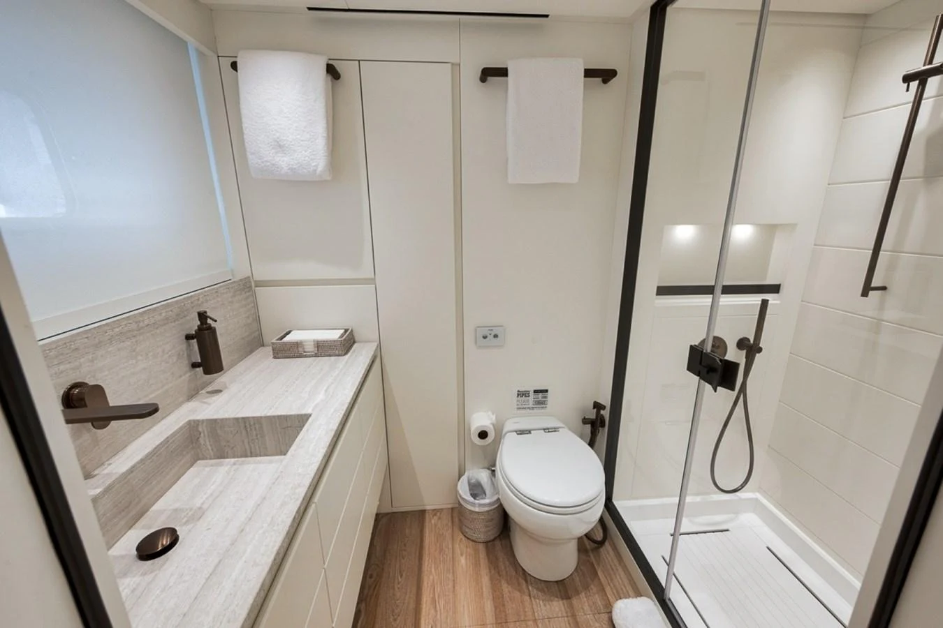 The yacht's bathroom features a modern design with a spacious shower and elegant fixtures. aboard LAUREN MARIE Yacht for Sale