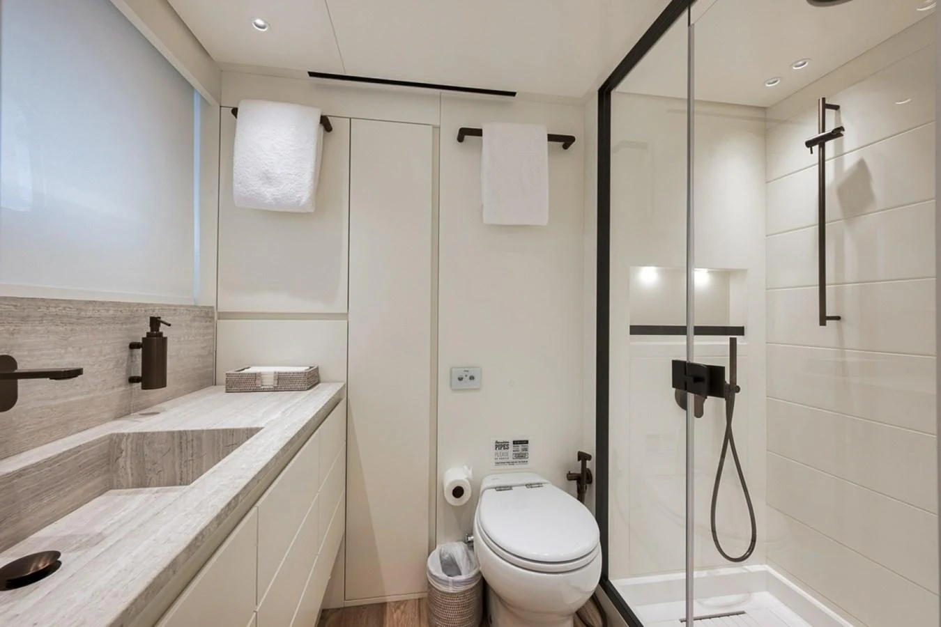 The yacht's bathroom features modern fixtures and a sleek design. aboard LAUREN MARIE Yacht for Sale