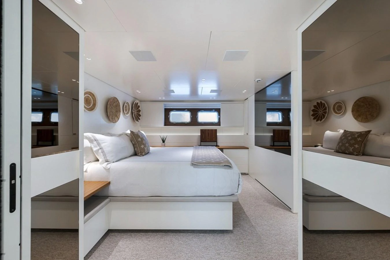 This stateroom features a spacious bed with elegant decor and ample natural light. aboard LAUREN MARIE Yacht for Sale