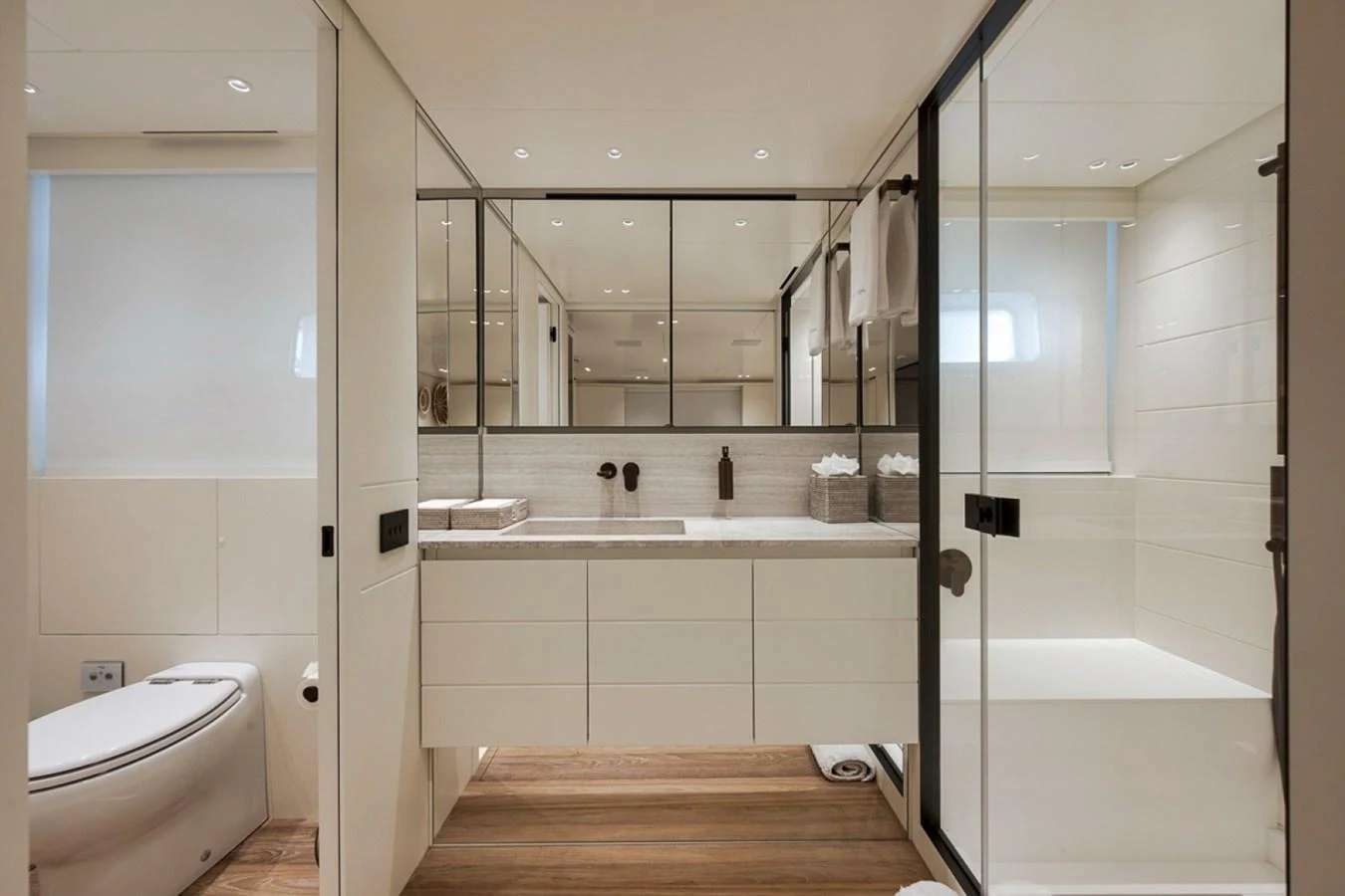 The yacht's bathroom features a sleek, modern design with ample natural light and high-end fixtures. aboard LAUREN MARIE Yacht for Sale