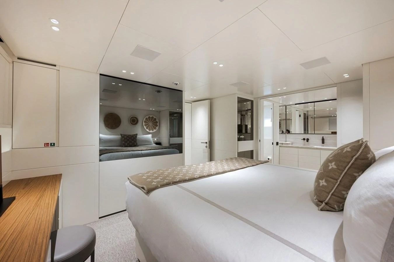 The master stateroom features a luxurious bed, elegant decor, and ample storage space. aboard LAUREN MARIE Yacht for Sale
