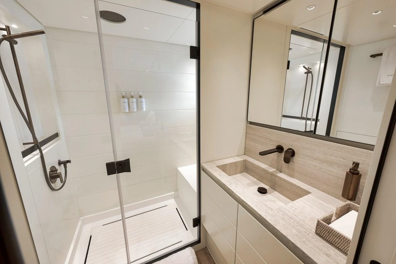 A modern yacht bathroom featuring a sleek shower and elegant fixtures. aboard LAUREN MARIE Yacht for Sale