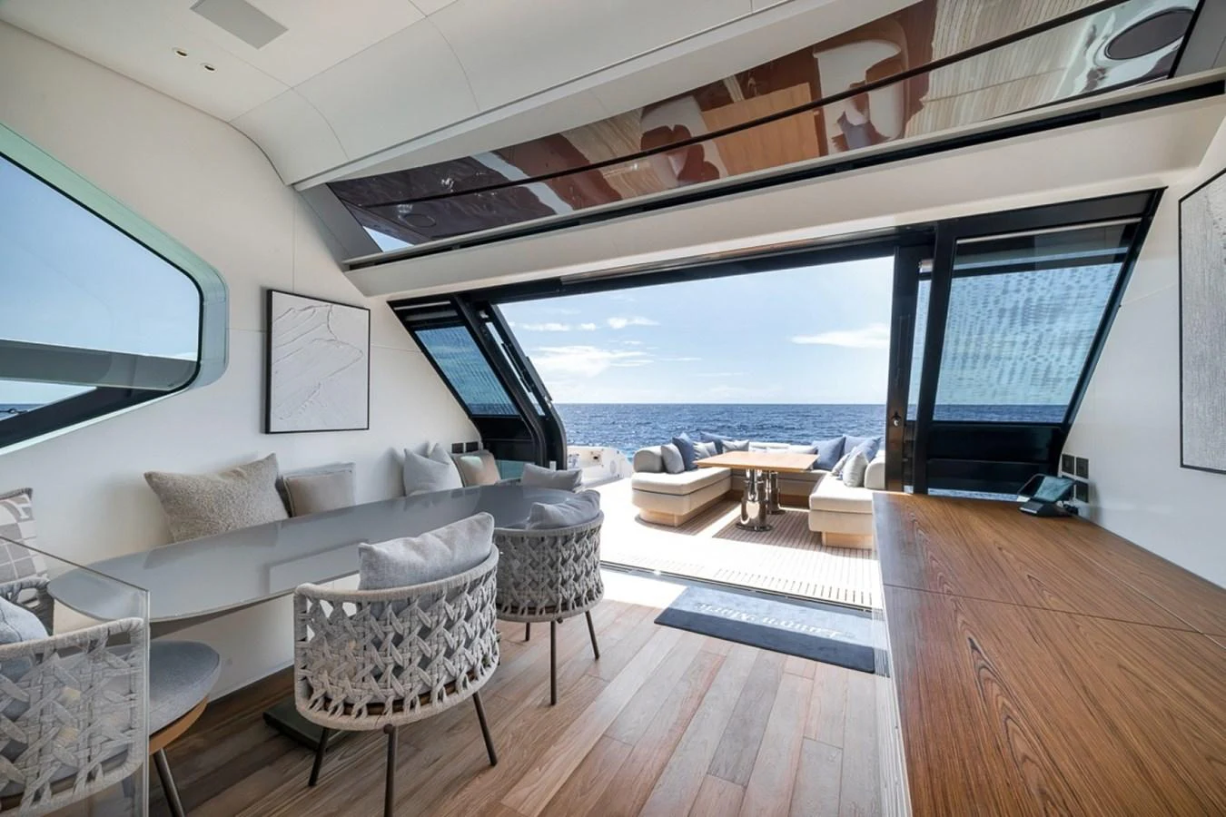 The salon offers a seamless transition to the aft deck with panoramic ocean views. aboard LAUREN MARIE Yacht for Sale