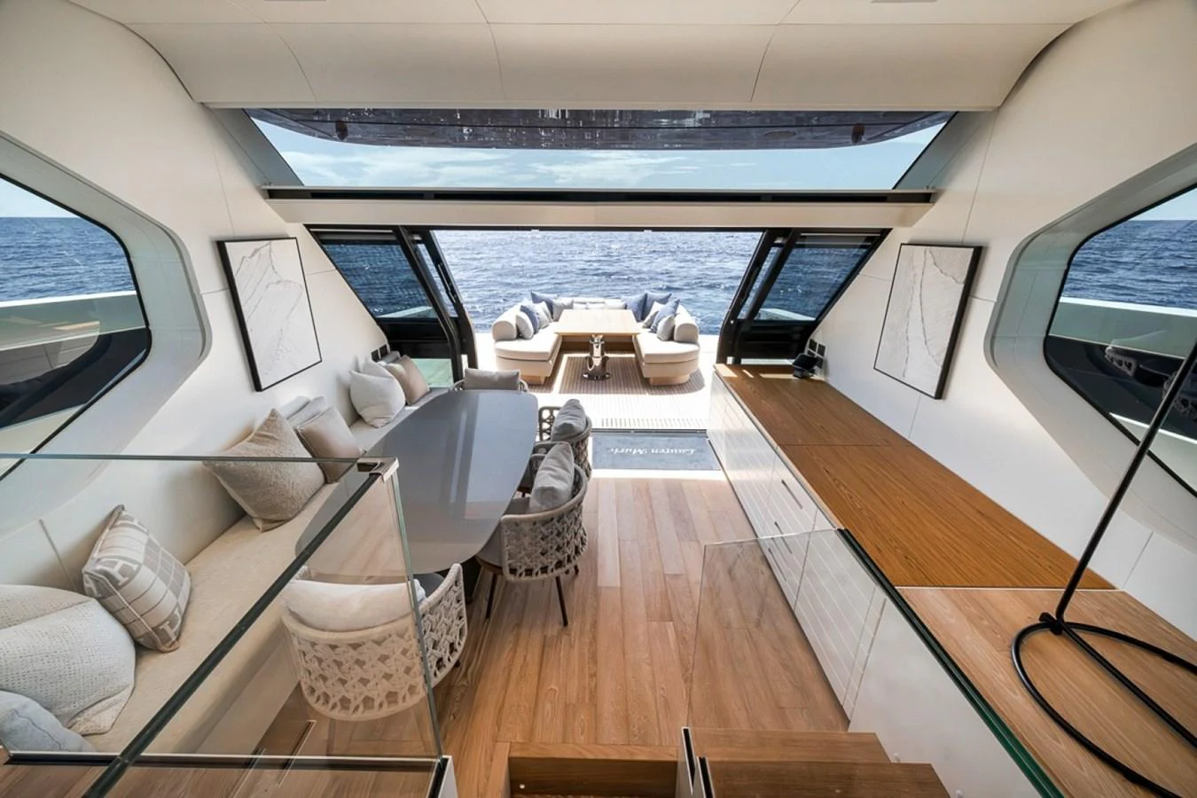 The salon features a spacious and elegant design with a seamless transition to the aft deck, offering stunning ocean views. aboard LAUREN MARIE Yacht for Sale
