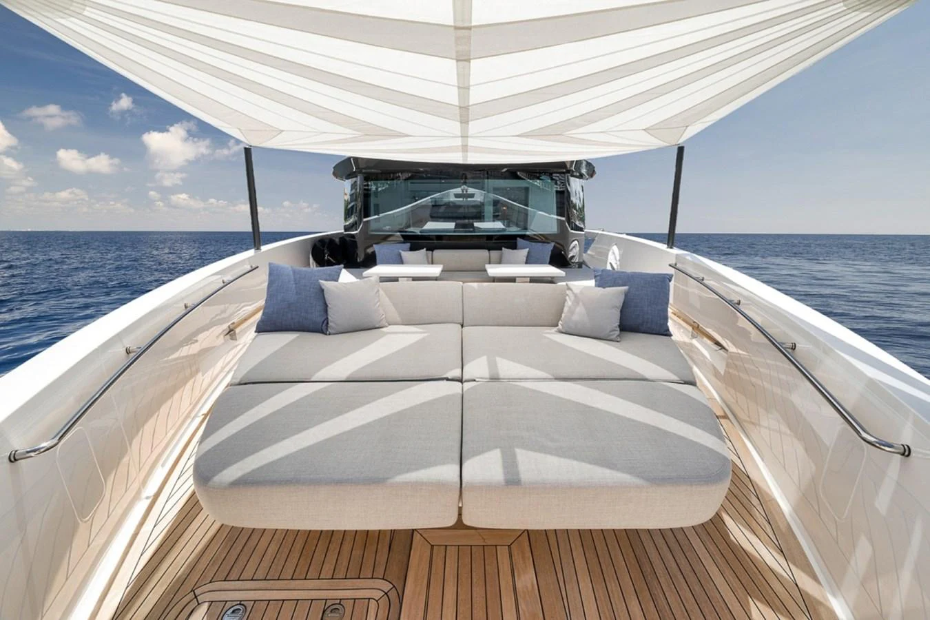The sundeck offers a spacious lounging area with comfortable seating and shade. aboard LAUREN MARIE Yacht for Sale
