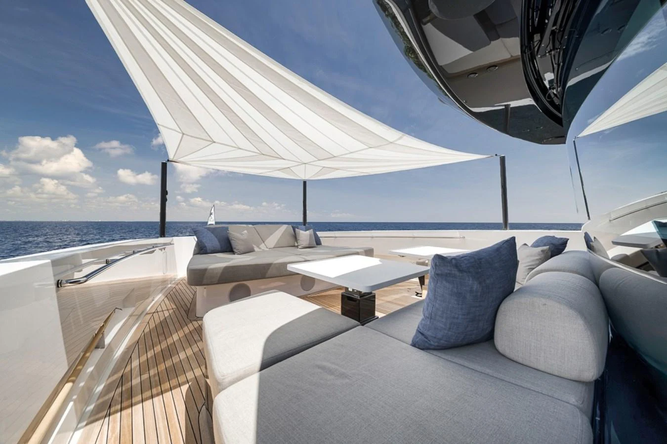 The sundeck offers a luxurious lounging area with plush seating and a stylish sunshade, perfect for relaxation. aboard LAUREN MARIE Yacht for Sale