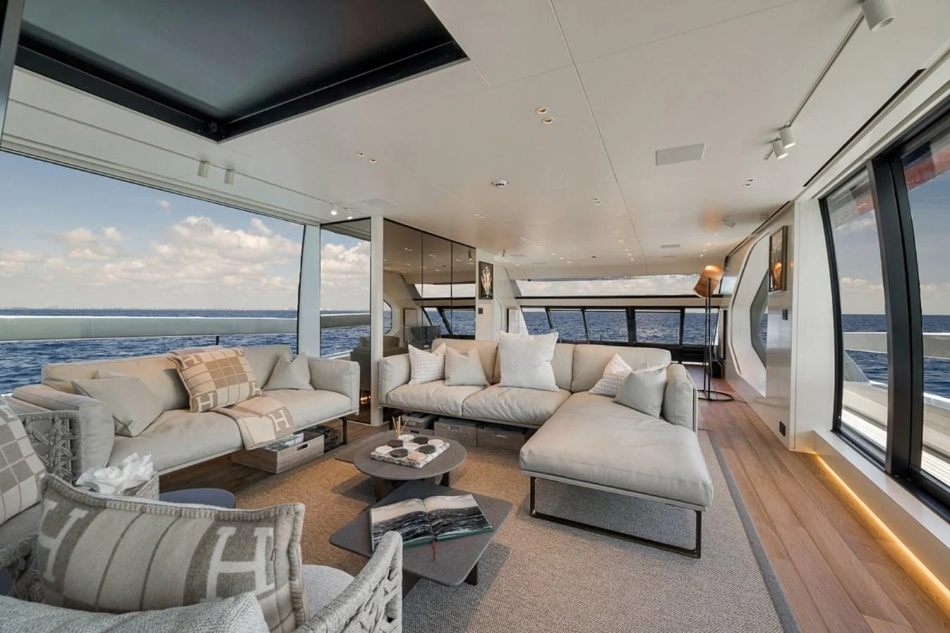 The salon offers a spacious and luxurious seating area with panoramic views of the sea. aboard LAUREN MARIE Yacht for Sale