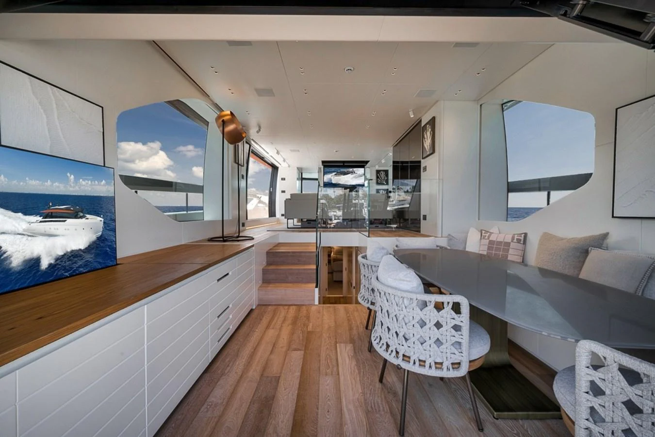 The salon features a modern design with ample natural light and luxurious furnishings. aboard LAUREN MARIE Yacht for Sale