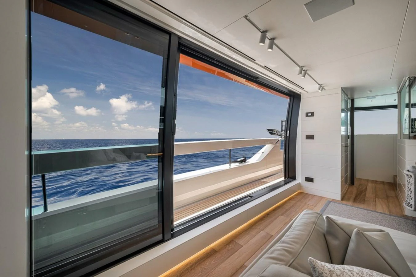 The salon features expansive windows offering stunning ocean views and abundant natural light. aboard LAUREN MARIE Yacht for Sale