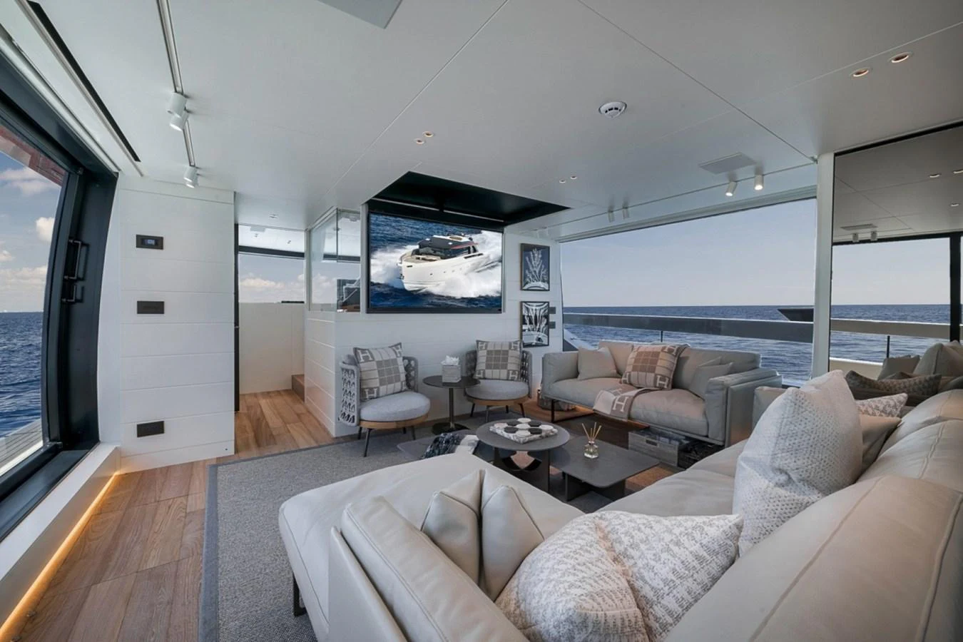 The salon offers a spacious and luxurious seating area with panoramic ocean views. aboard LAUREN MARIE Yacht for Sale