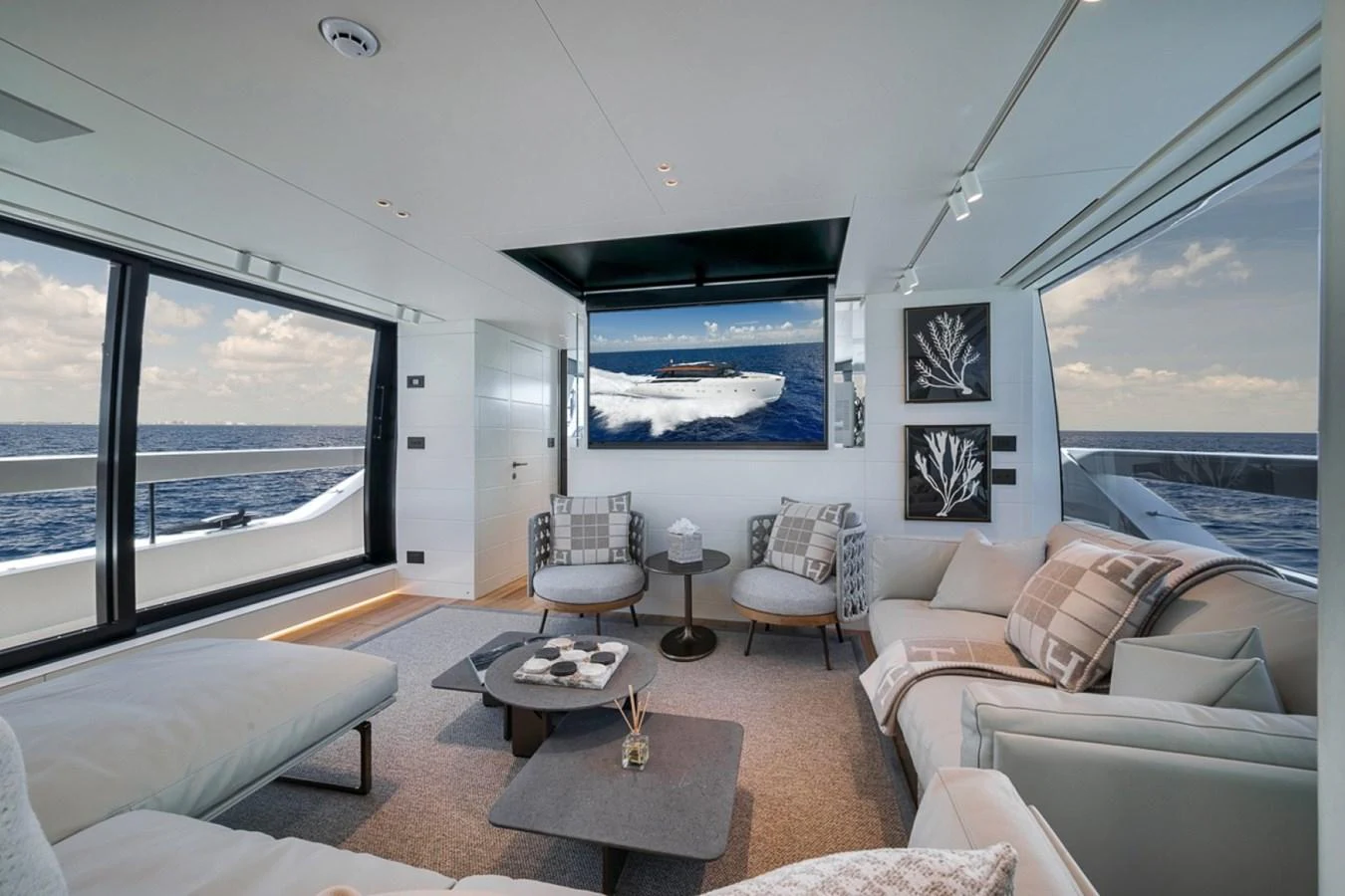 The salon features luxurious seating with panoramic ocean views. aboard LAUREN MARIE Yacht for Sale