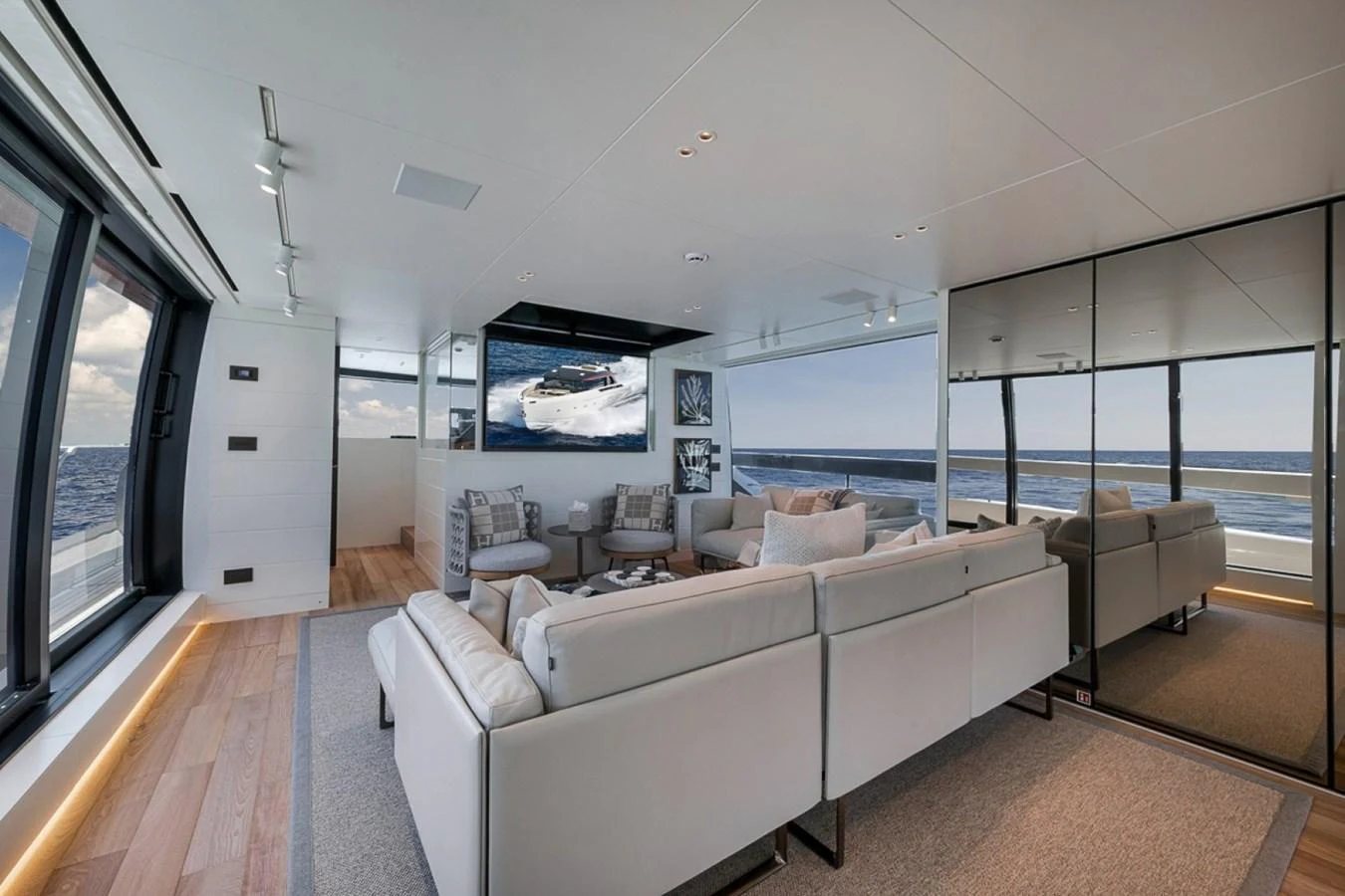The salon offers a spacious and modern seating area with panoramic ocean views. aboard LAUREN MARIE Yacht for Sale