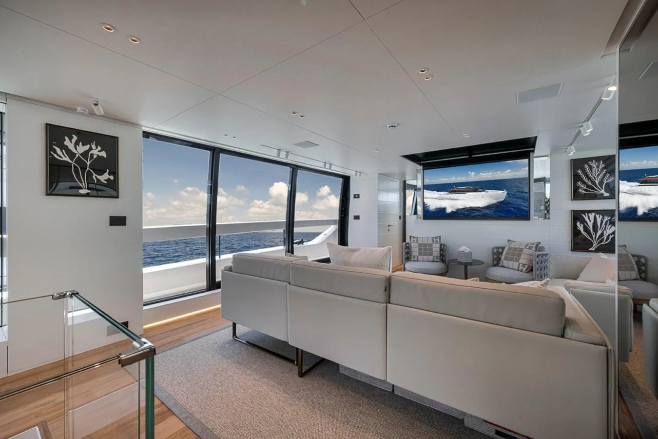 The salon offers a spacious and modern living area with panoramic ocean views. aboard LAUREN MARIE Yacht for Sale