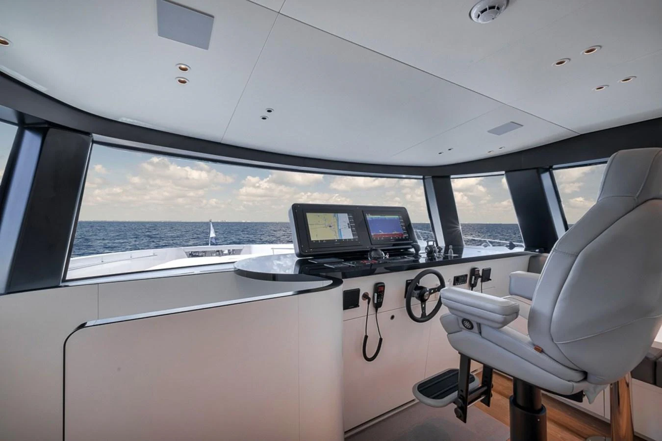 The helm station offers panoramic views and advanced navigation equipment. aboard LAUREN MARIE Yacht for Sale