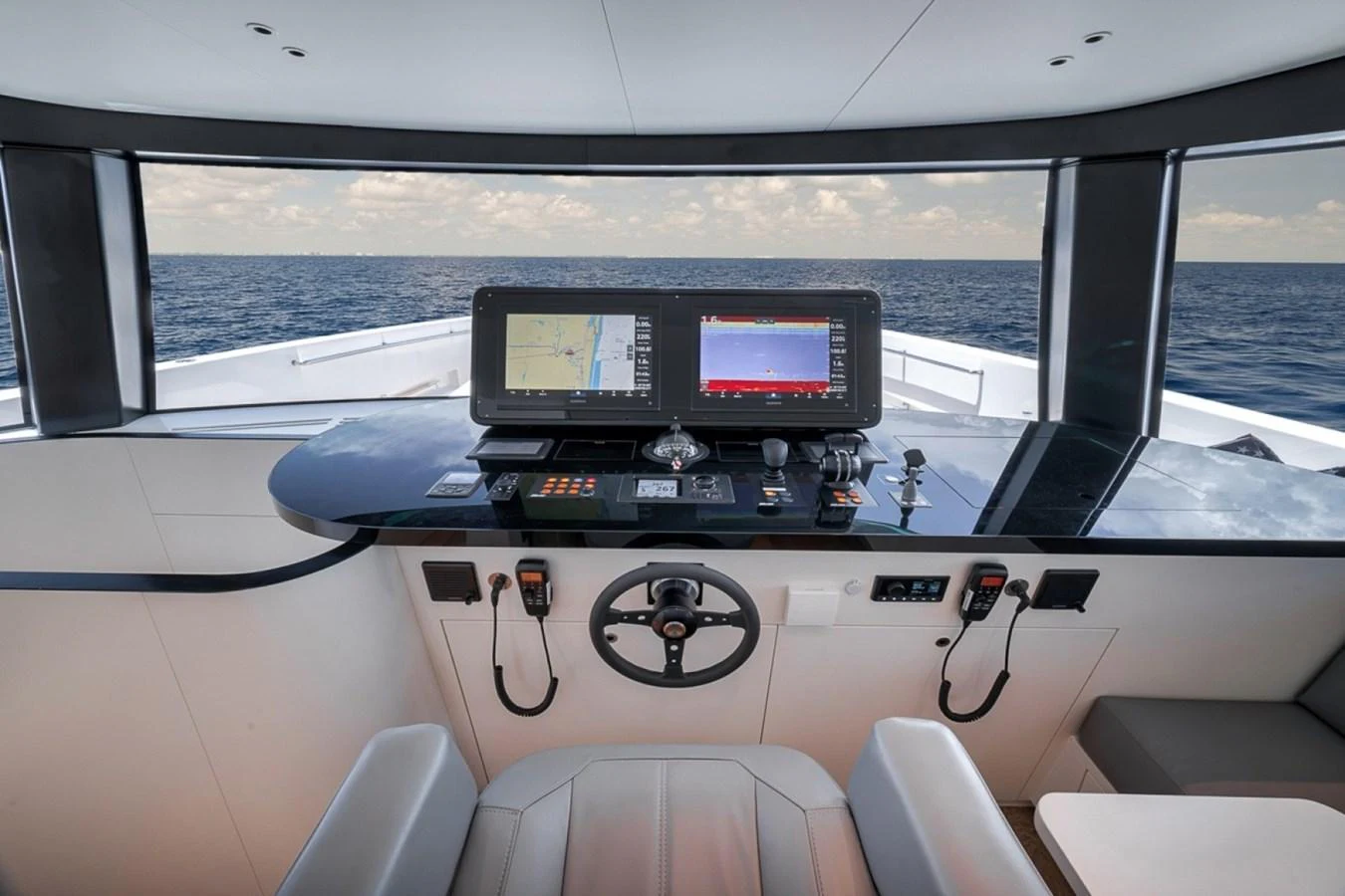 The helm station offers a commanding view of the open sea with state-of-the-art navigation equipment. aboard LAUREN MARIE Yacht for Sale