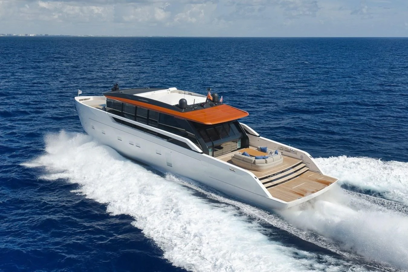 A sleek and modern yacht cruises swiftly through the open sea, showcasing its elegant design and spacious deck. aboard LAUREN MARIE Yacht for Sale