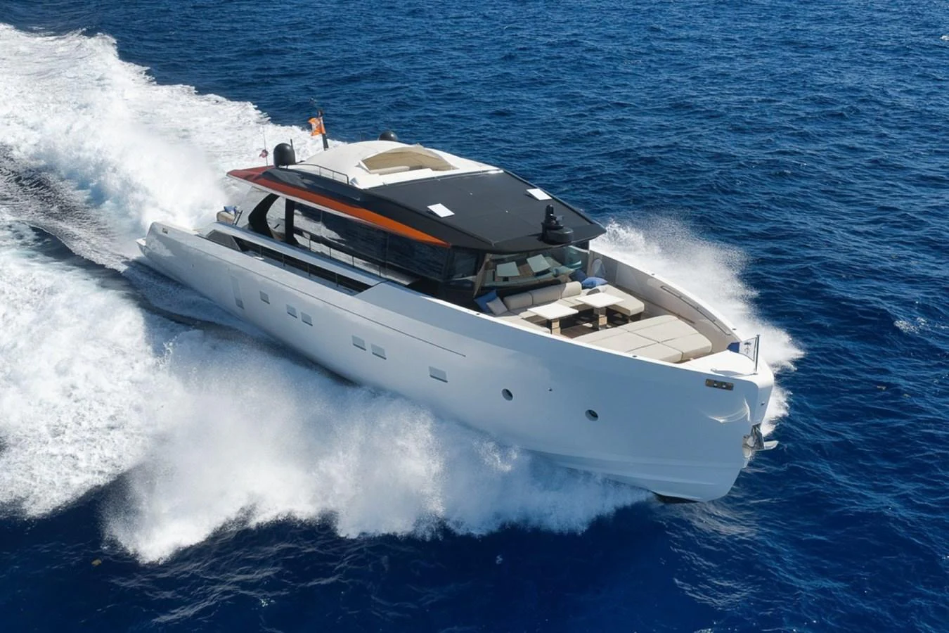A sleek, modern yacht cruises swiftly through the open sea, showcasing its elegant design and luxurious amenities. aboard LAUREN MARIE Yacht for Sale
