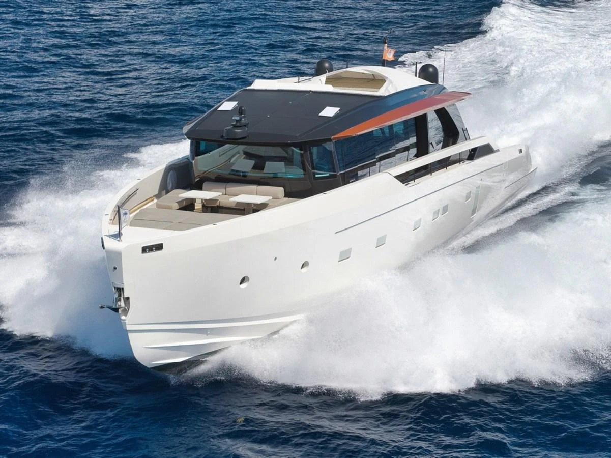 A sleek and modern yacht cruises swiftly through the open water, showcasing its elegant design and powerful performance. aboard LAUREN MARIE Yacht for Sale