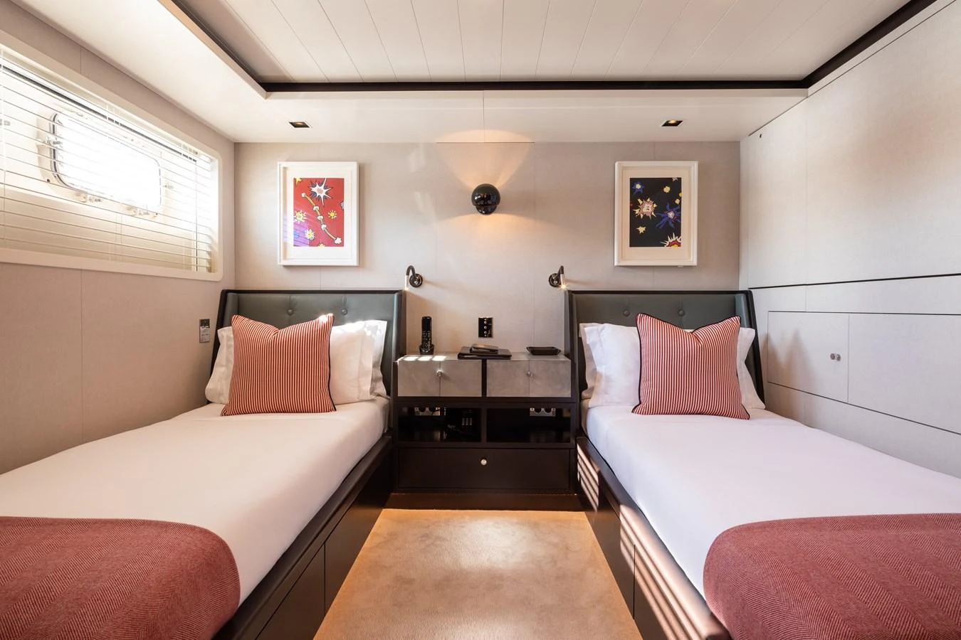 The guest stateroom features twin beds with elegant decor and ample lighting. aboard MIRAGE Yacht for Sale