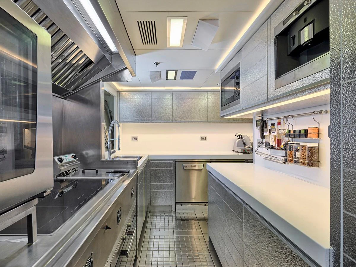The yacht's galley is equipped with modern appliances and ample counter space, perfect for gourmet cooking. aboard BELITA Yacht for Sale