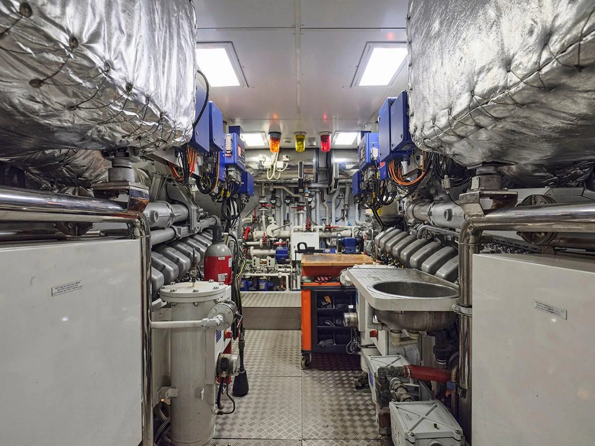 The image showcases the well-equipped engine room of the yacht, highlighting its advanced machinery and organized layout. aboard BELITA Yacht for Sale