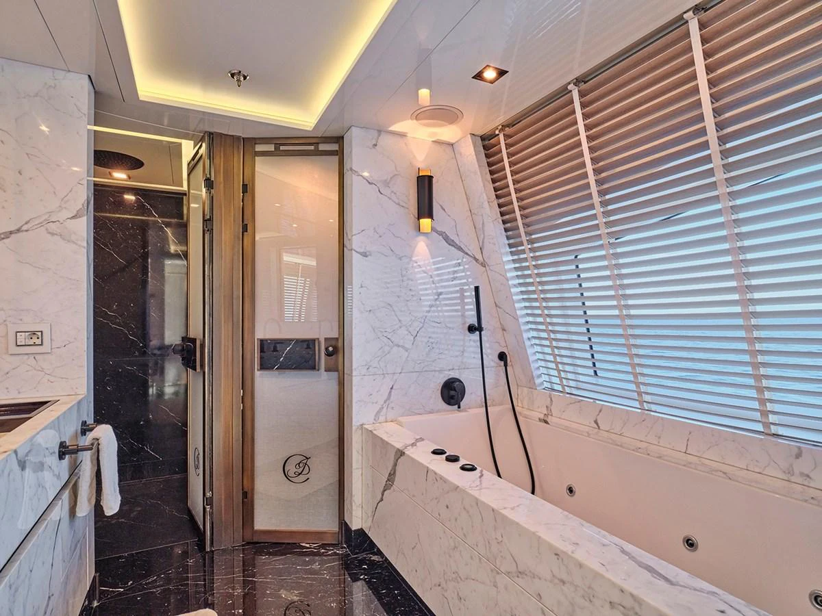 The yacht's bathroom features luxurious marble finishes and modern fixtures. aboard BELITA Yacht for Sale