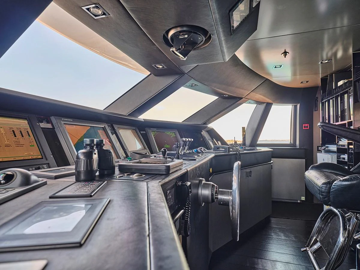 The helm station features advanced navigation equipment and a sleek, modern design. aboard BELITA Yacht for Sale