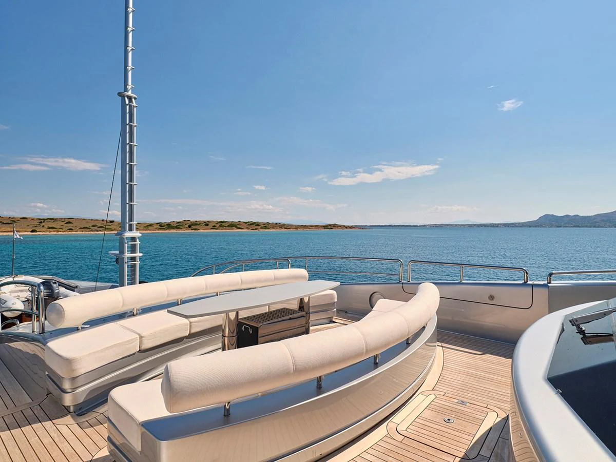 The yacht's aft deck offers a spacious seating area with stunning views of the surrounding waters. aboard BELITA Yacht for Sale