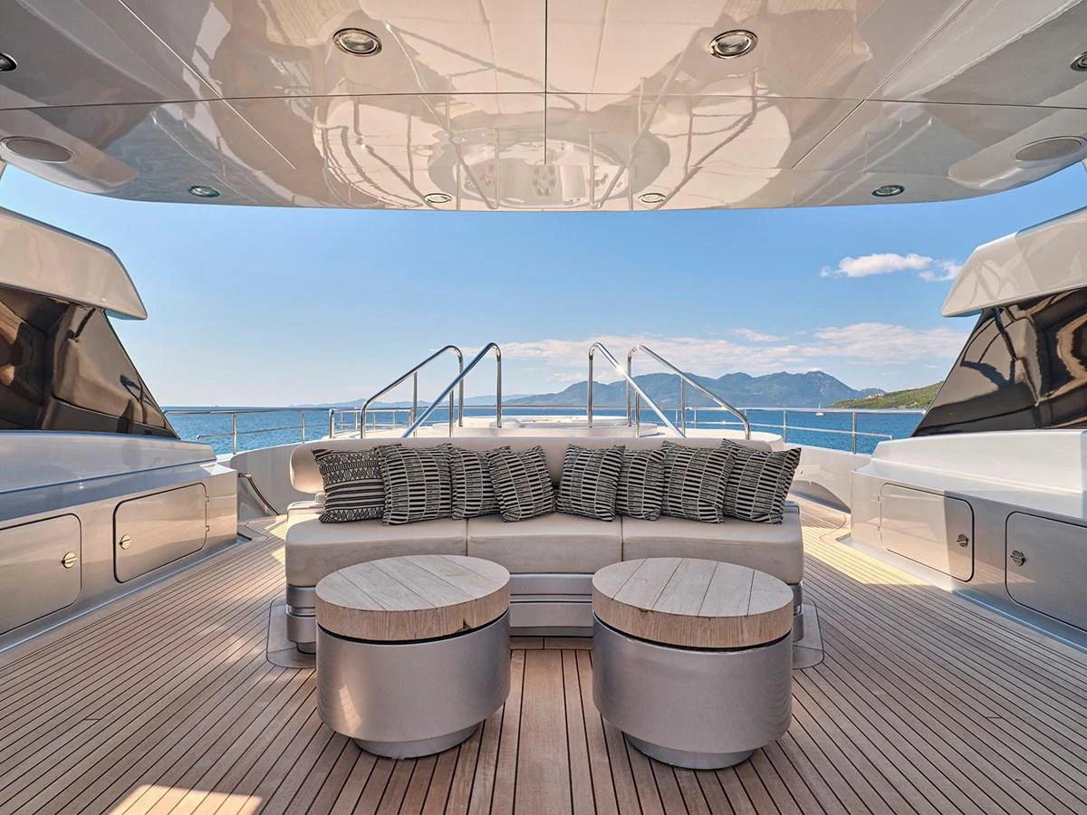 The aft deck offers a luxurious seating area with stunning views of the surrounding waters. aboard BELITA Yacht for Sale