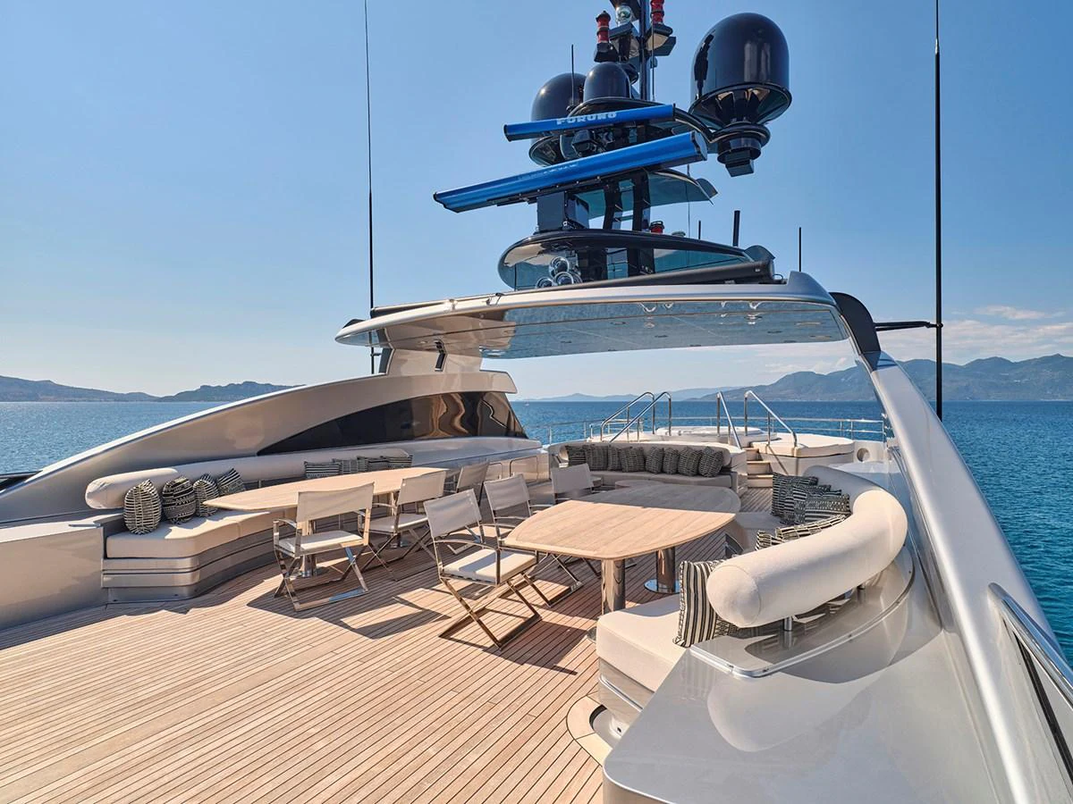 The yacht's sundeck offers a spacious and luxurious area for relaxation and socializing with stunning ocean views. aboard BELITA Yacht for Sale
