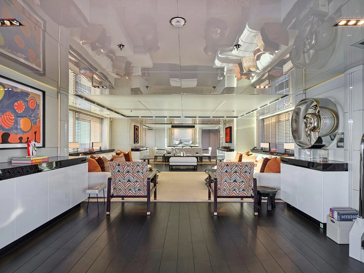 The yacht's interior features a spacious and modern living area with stylish furnishings and contemporary decor. aboard BELITA Yacht for Sale