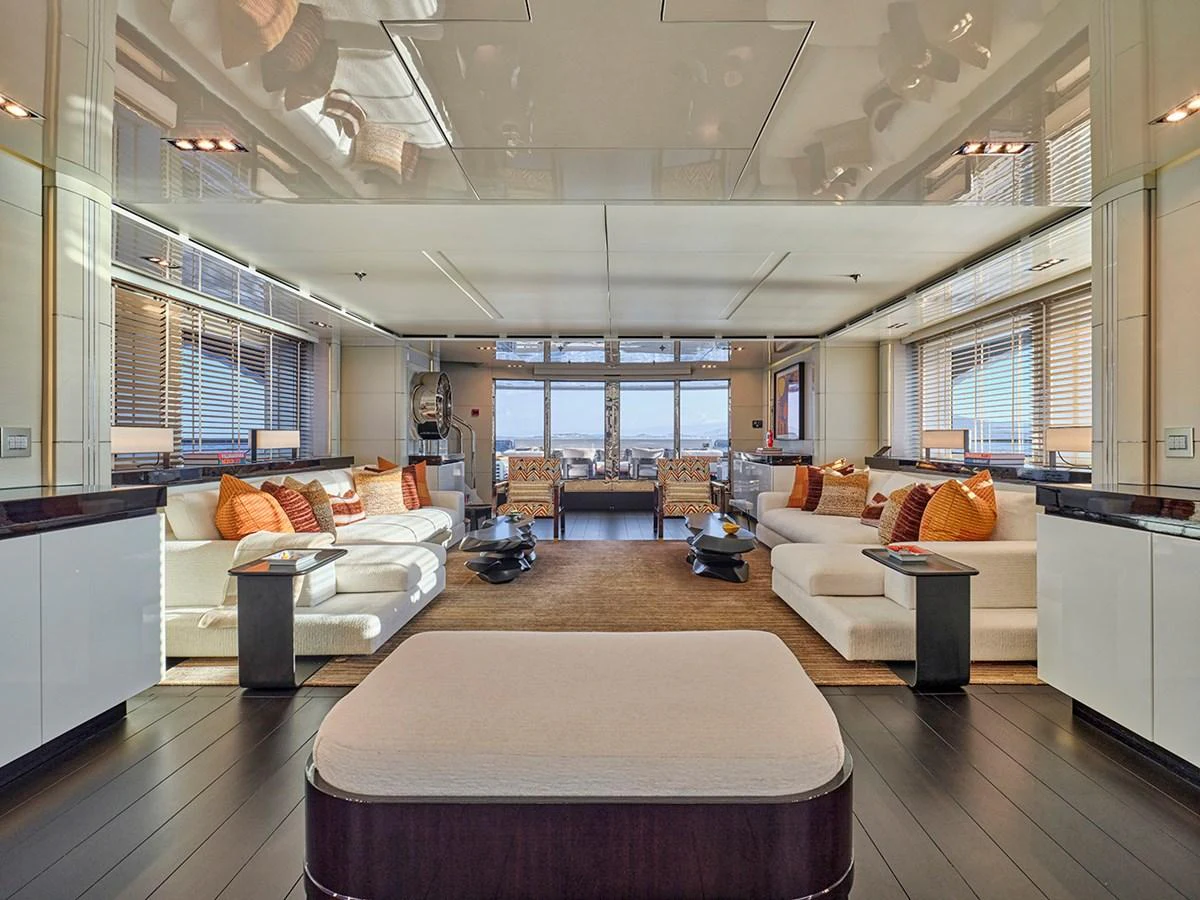The salon features luxurious seating and expansive windows, offering a comfortable and elegant space for relaxation. aboard BELITA Yacht for Sale
